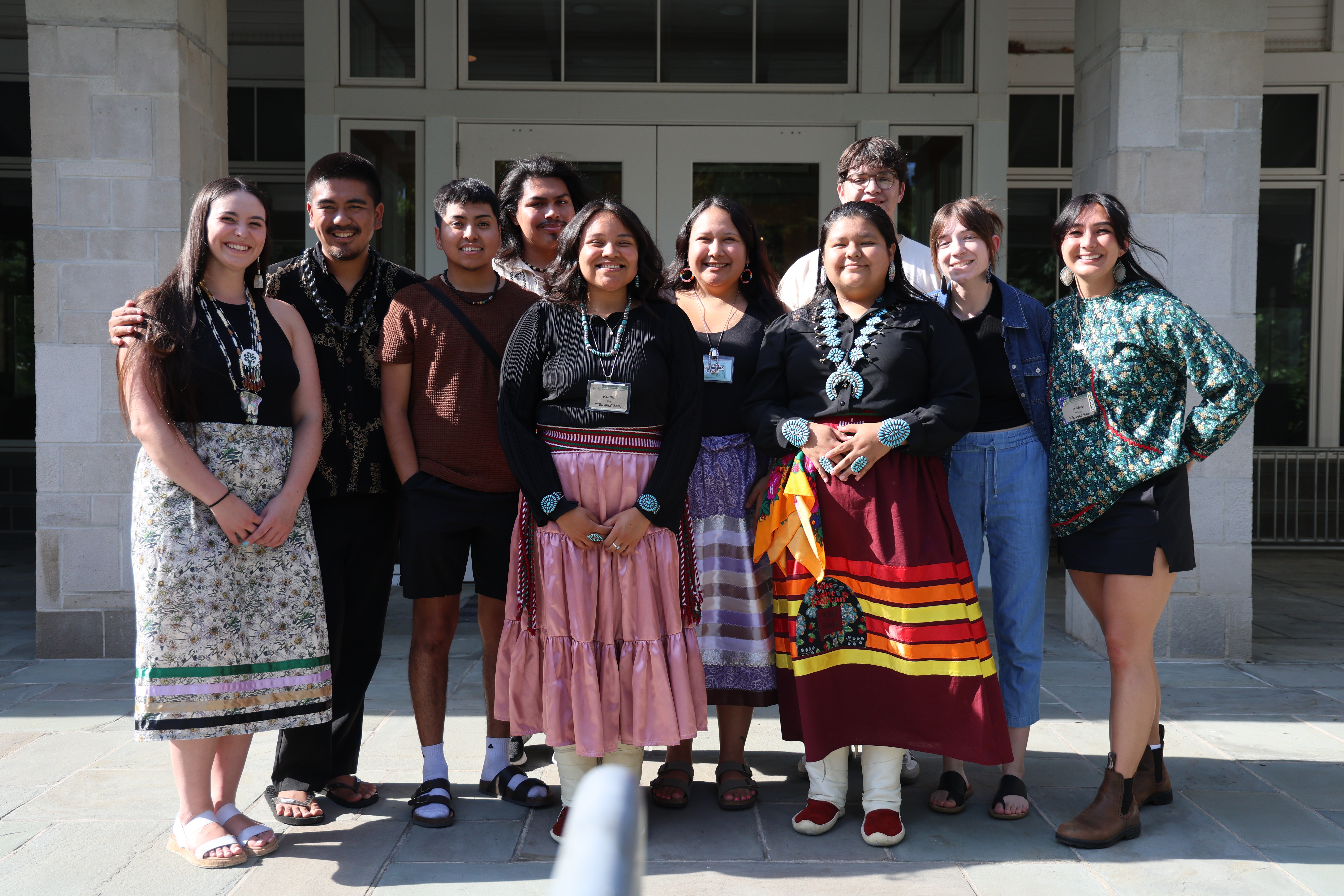 A group of Indigenous youth pose together in a group